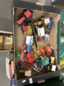 Box of various assorted toy tractors and farm implements, play worn condition throughout