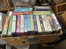Box of assorted videos