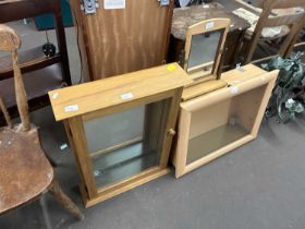 Two display cabinets and a dressing table mirror