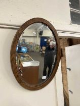 Oval oak framed wall mirror