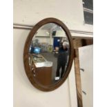 Oval oak framed wall mirror