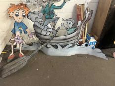 Cut out sheet metal figure group of a man and a boy in a boat, originally from the snails ride,