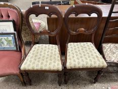 A pair of Victorian mahogany balloon back dining chairs