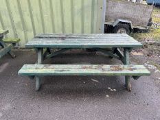 A green painted picnic bench