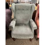 Button back wing armchair
