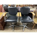 Pair of vintage iron framed barbers chairs