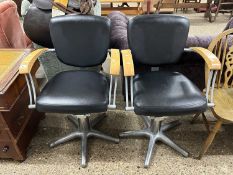 Pair of vintage iron framed barbers chairs
