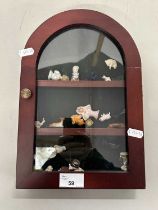 Small display cabinet containing various small ornaments, pin cushion dolls etc