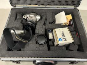 Minolta 404Si camera with lenses and accessories in a fitted travel case