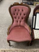 Pink upholstered button back chair