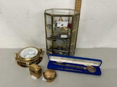 Small table top display cabinet with various contents, a cased House of Commons paper knife, a brass