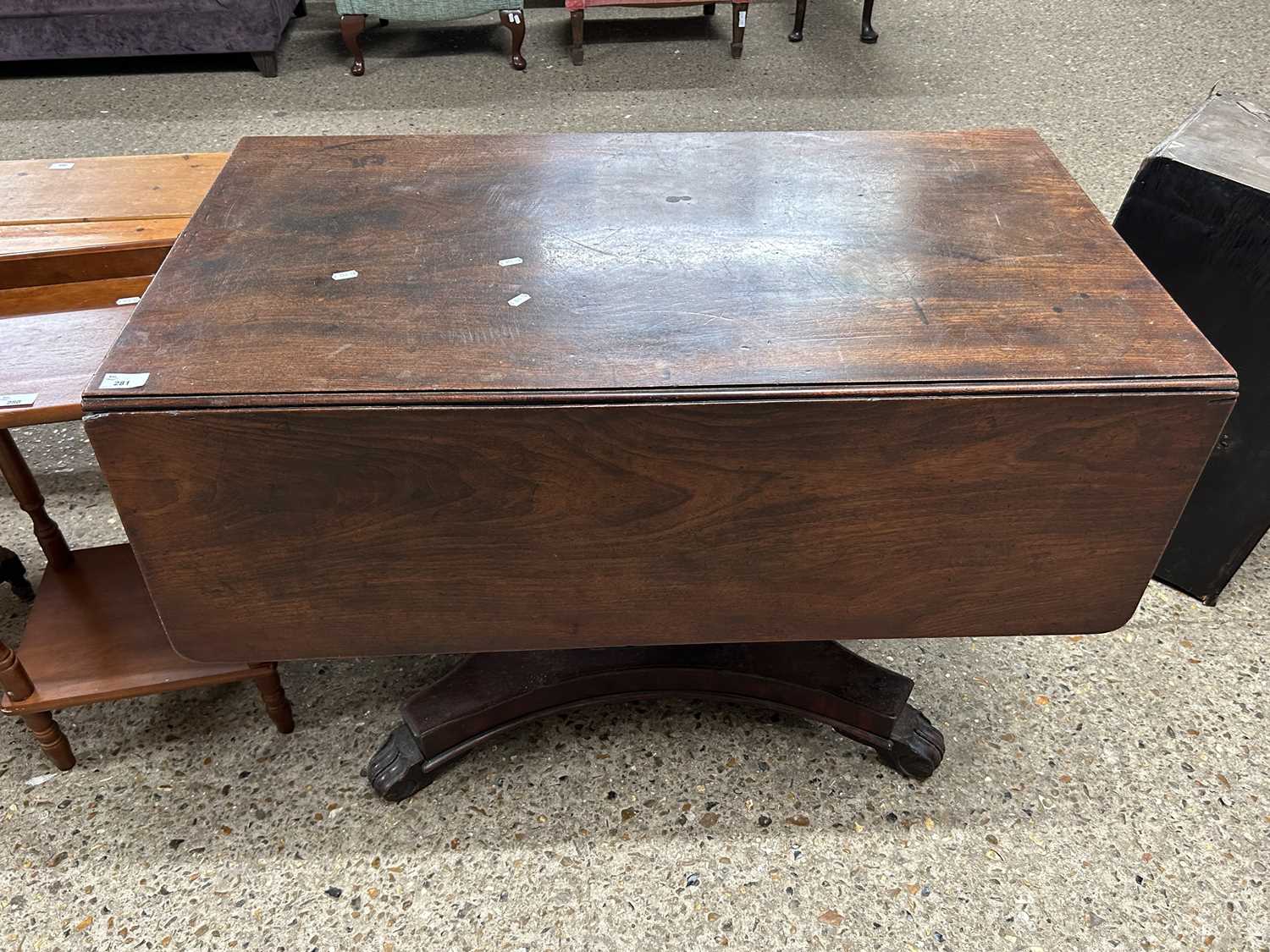 19th Century mahogany pedestal Pembroke table with platform base and carved scrolled legs