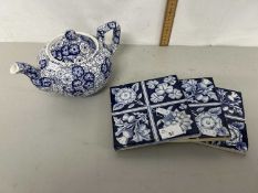 A group of three Victorian blue and white tiles together with a Burleigh ware teapot