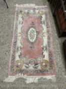 Small Chinese floral decorated wool rug