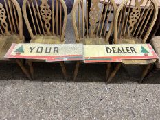 Two metal signs marked Your Dealer