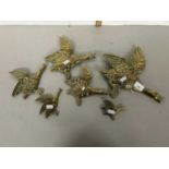 A graduated set of brass wall ducks