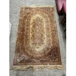 Small beige patterned rug
