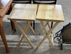 A pair of modern folding tables