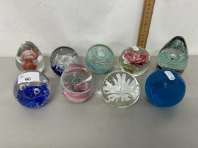 Group of nine various modern paper weights