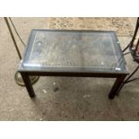 Glass top coffee table decorated with a Medieval scene