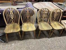 Set of four wheel back kitchen chairs