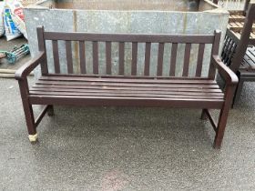 A pair of painted garden benches and accompanying table (3)
