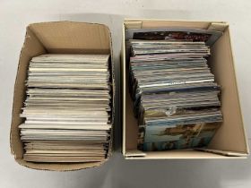 Two boxes of various assorted postcards