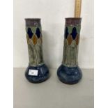 Pair of Royal Doulton vases with stylised tubelined design, one with significant damage to top