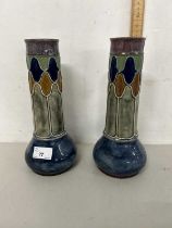 Pair of Royal Doulton vases with stylised tubelined design, one with significant damage to top