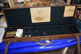 A leather gun case by Holland & Holland