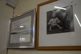 Print of a baby and dog and a monochromatic landscape