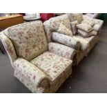 Floral upholstered two seater sofa and matching armchair