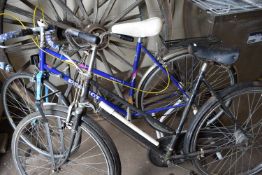 A ladies Peugeot road bike together with another ladies bicycle