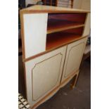 A cream, red and gilt painted corner cabinet