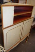 A cream, red and gilt painted corner cabinet