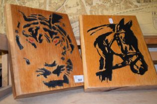 Two carved intaglio wooden panels, one of a tiger the other a horse