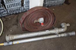 A reel of firemans hose and piping