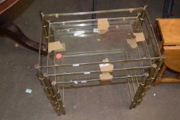Set of three metal and glass topped nesting tables (a/f)