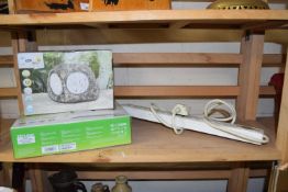 A solar garden light and a wireless access point, boxed