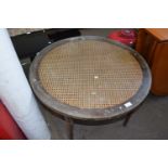 Rattan and glass topped round coffee table