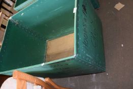 A green plastic and plywood vintage laundry bin on casters