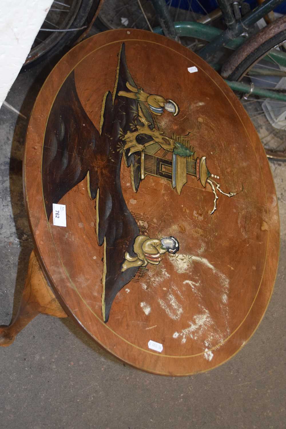 An oval Chinese painted coffee table