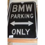 A metal BMW Parking Only sign