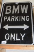 A metal BMW Parking Only sign