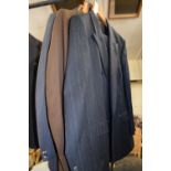 A gents Marks & Spencer navy blue pin striped suit and two others