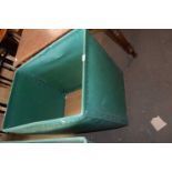 A green plastic and plywood vintage laundry bin on casters