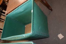 A green plastic and plywood vintage laundry bin on casters