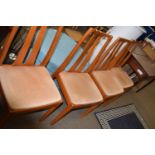 A set of four mid 20th Century dining chairs