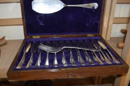 A white metal fish service, cased
