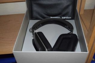 A pair of Harman/Cardon headphones with carry case, boxed